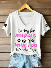 Women's caring for animals isn't what I do it's who I am V-neck T-shirts